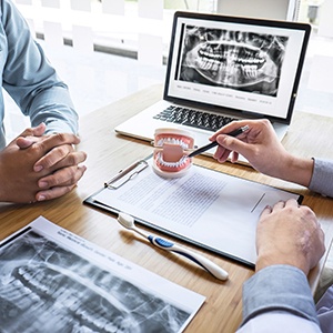 A patient consulting their dentist about treatment