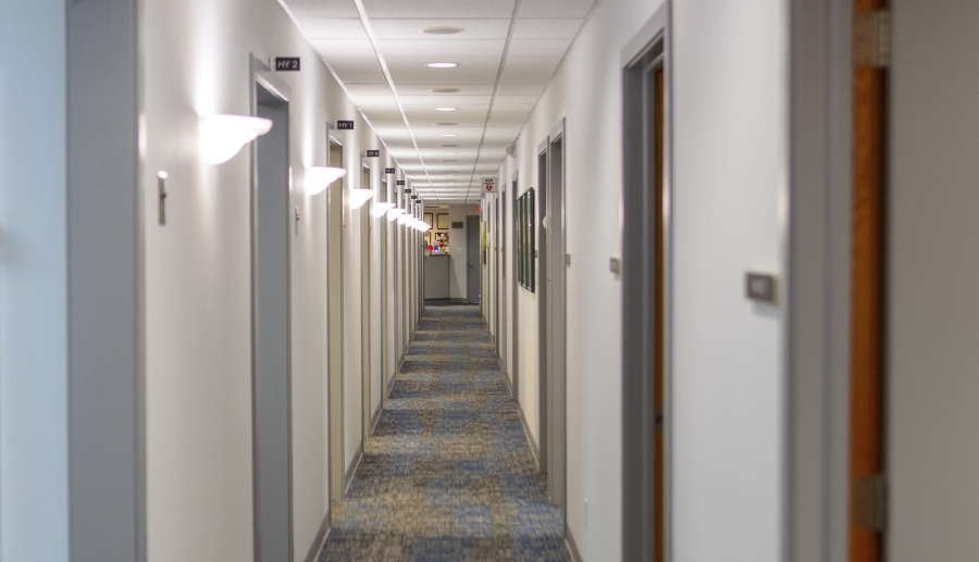 Hallway branching off into several dental treatment rooms